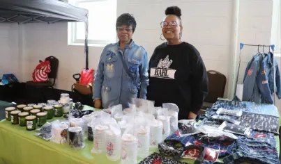Two vendors at the BAHL table