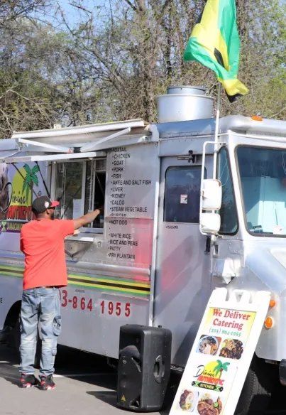 A Jamaican food truck at a BIYC event