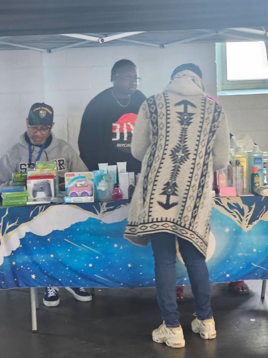 Vendors and shoppers at a BIYC table