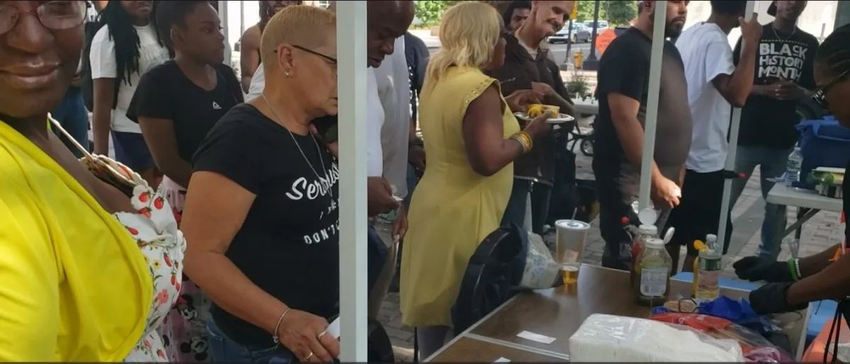 People in line for food at a BIYC event