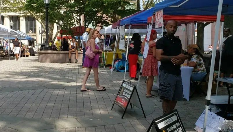 Vendor tents at an outdoor BIYC market downtown